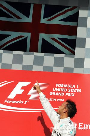 Podium: race winner Lewis Hamilton