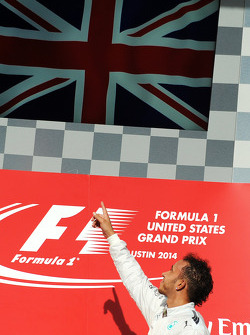 Podium: race winner Lewis Hamilton