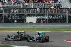 Lewis Hamilton, Mercedes AMG F1 W05 passes team mate Nico Rosberg, Mercedes AMG F1 W05 to take the lead of the race