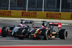 Jenson Button, McLaren MP4-29 and Romain Grosjean, Lotus F1 E22
