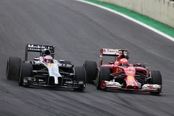 Jenson Button, McLaren F1 Team and Kimi Raikkonen, Scuderia Ferrari