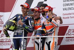 Podium: race winner Marc Marquez, second place Valentino Rossi, third place Jorge Lorenzo