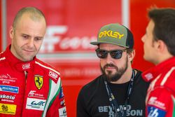 Gianmaria Bruni and James Calado talking to Fernando Alonso