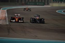Fernando Alonso, Ferrari F14-T and Jenson Button, McLaren MP4-29 battle for position