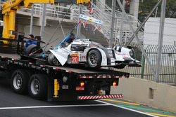 The Porsche 919 Hybrid of Mark Webber is taken away after a major crash with Matteo Cressoni