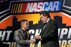 NASCAR Mexico Series champion Abraham Calderon gets a championship ring from NASCAR president Mike H