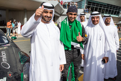Race winner Abdulaziz Al Faisal celebrates with friend
