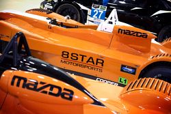 Various 8Star Motorsports cars in the team's workshops