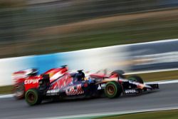 Carlos Sainz Jr., Scuderia Toro Rosso STR10 passes Kimi Raikkonen, Ferrari SF15-T