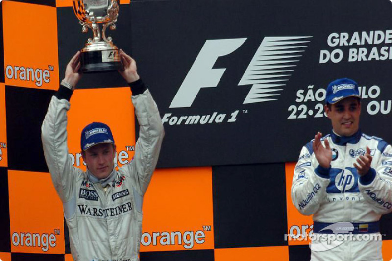 Podium: Kimi Raikkonen and Juan Pablo Montoya