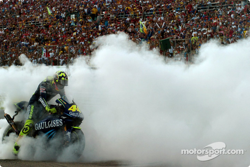 Race winner Valentino Rossi celebrates with a burnout