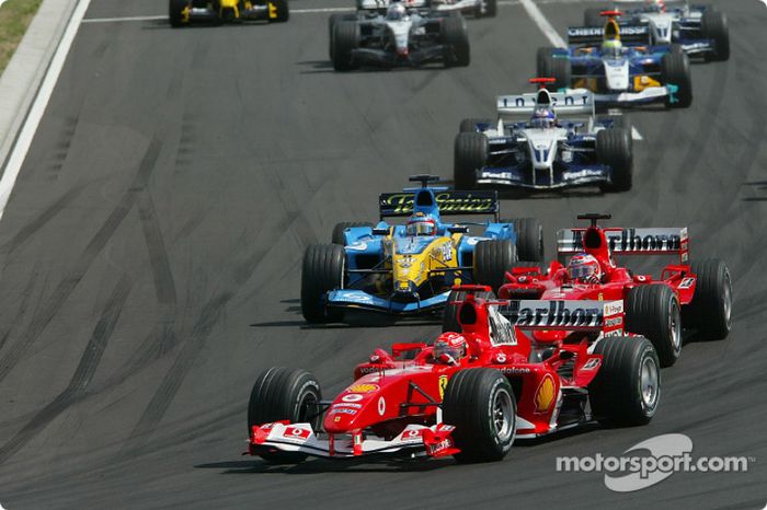 Primera curva Michael Schumacher lleva Rubens Barrichello y Fernando Alonso