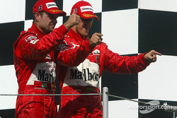 Podium: Rubens Barrichello and Michael Schumacher celebrate
