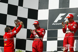 Podium: Rubens Barrichello, Jean Todt and Michael Schumacher celebrate