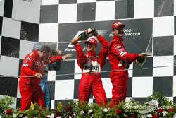 Podium: champagne for Jean Todt, Fernando Alonso, Michael Schumacher and Rubens Barrichello