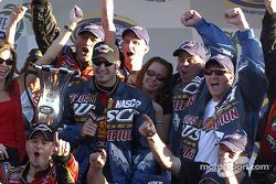 NASCAR Busch Series 2004 champion Martin Truex Jr. celebrates with team owners Teresa Earnhardt and Dale Earnhardt Jr.