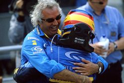 Race winner Fernando Alonso celebrates with Flavio Briatore