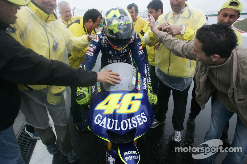 Race winner Valentino Rossi celebrates