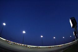 Race action under the lights at Darlington Raceway