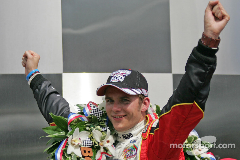 Victory lane: race winner Dan Wheldon celebrates