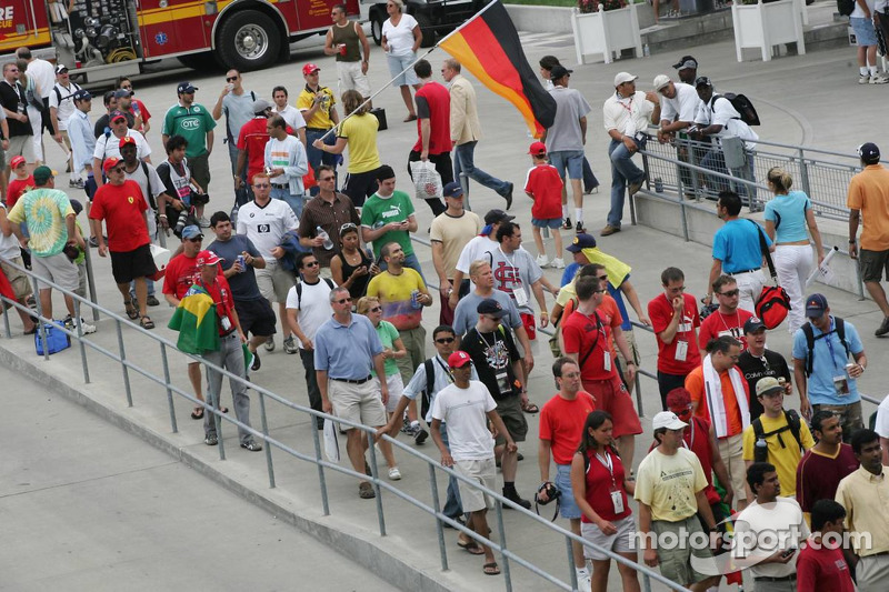Fans leave the track before the end of the race