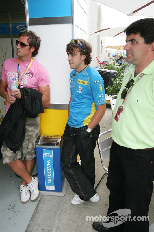 Fernando Alonso watches the race