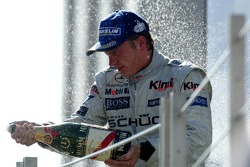 Podium: champagne for Kimi Raikkonen