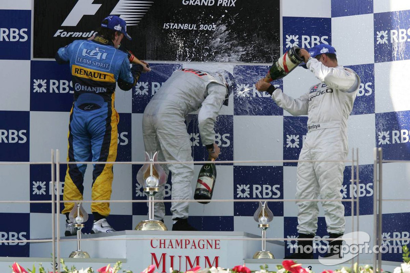 Podium: champagne for Kimi Raikkonen, Fernando Alonso and Juan Pablo Montoya