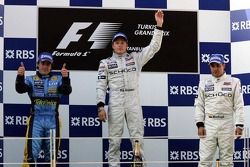 Podium: race winner Kimi Raikkonen with Fernando Alonso and Juan Pablo Montoya