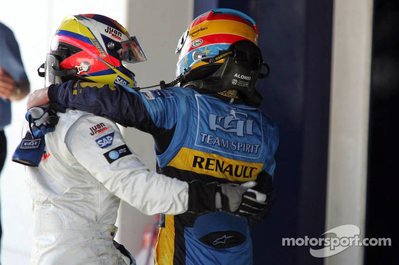 Fernando Alonso celebrates with Juan Pablo Montoya