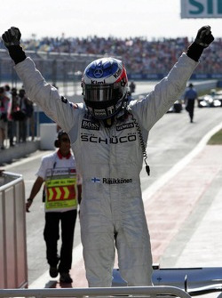 Race winner Kimi Raikkonen celebrates