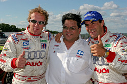 Race winners Frank Biela and Emanuele Pirro celebrate with Dave Maraj