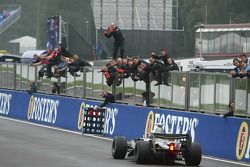 Race winner Kimi Raikkonen celebrates