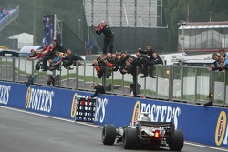 Race winner Kimi Raikkonen celebrates