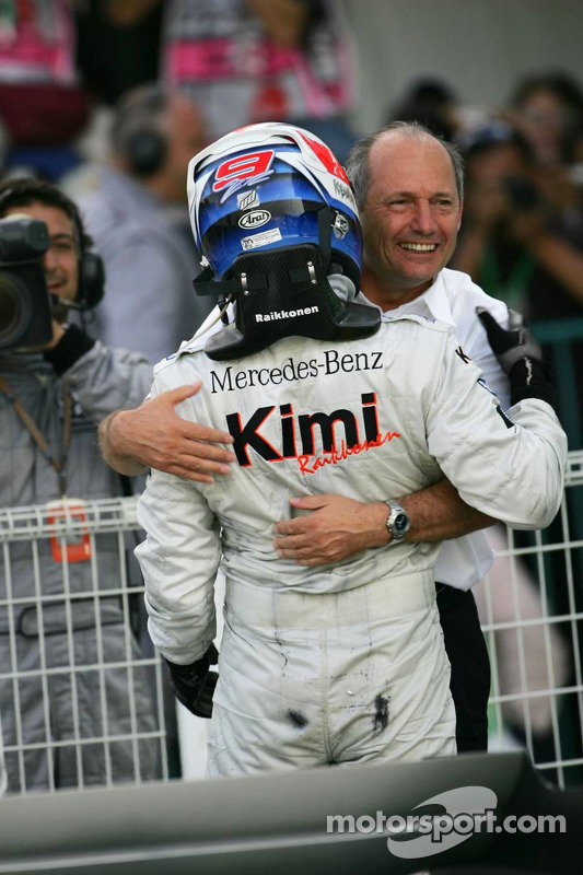 Race winner Kimi Raikkonen celebrates with Ron Dennis