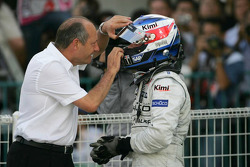 Race winner Kimi Raikkonen celebrates with Ron Dennis