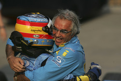 Race winner Fernando Alonso celebrates with Flavio Briatore