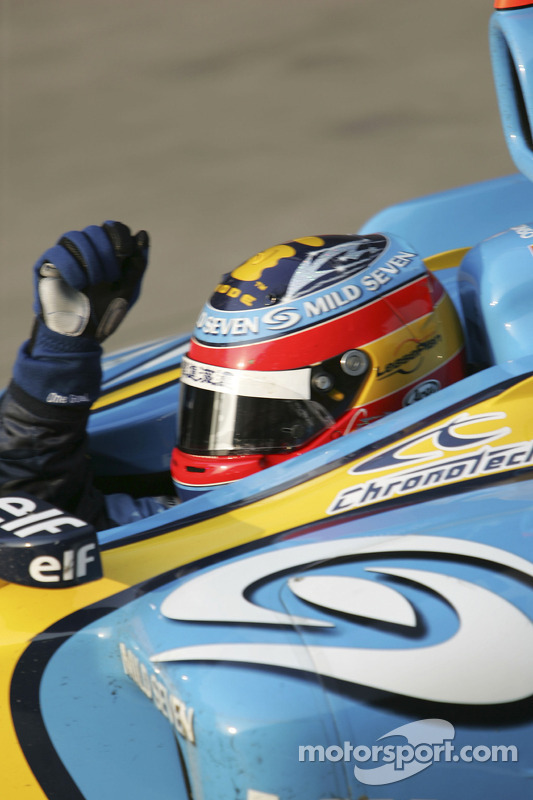 Race winner Fernando Alonso celebrates