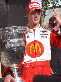 Race winner and Champ Car World Series 2005 champion Sébastien Bourdais celebrates poses with the Vanderbilt Cup