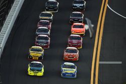 A seagull flies over Daytona during a restart