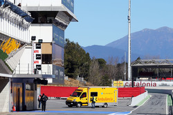 Fernando Alonso, McLaren is brought back in to the pits in an ambulance