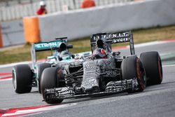 Daniil Kvyat, Red Bull Racing RB11 leads Nico Rosberg, Mercedes AMG F1 W06