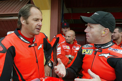 Gerhard Berger rides the Ducati MotoGP Desmosedici with Randy Mamola