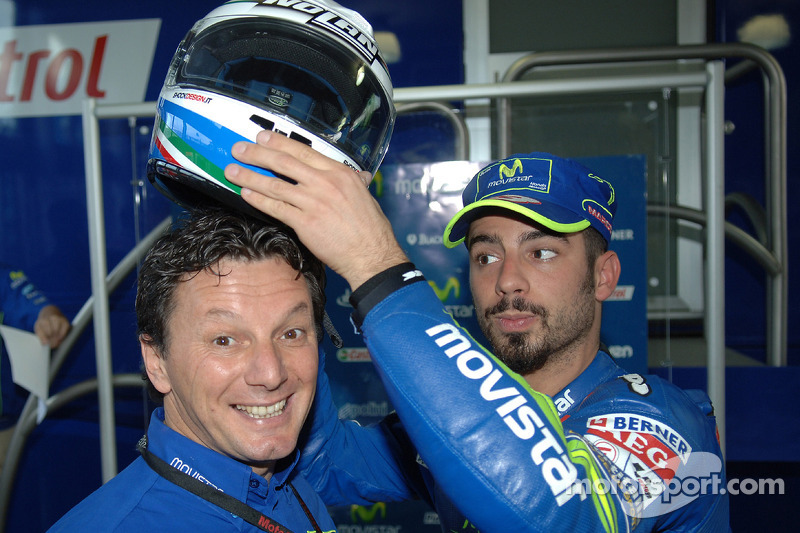 Race winner Marco Melandri celebrates with Fausto Gresini