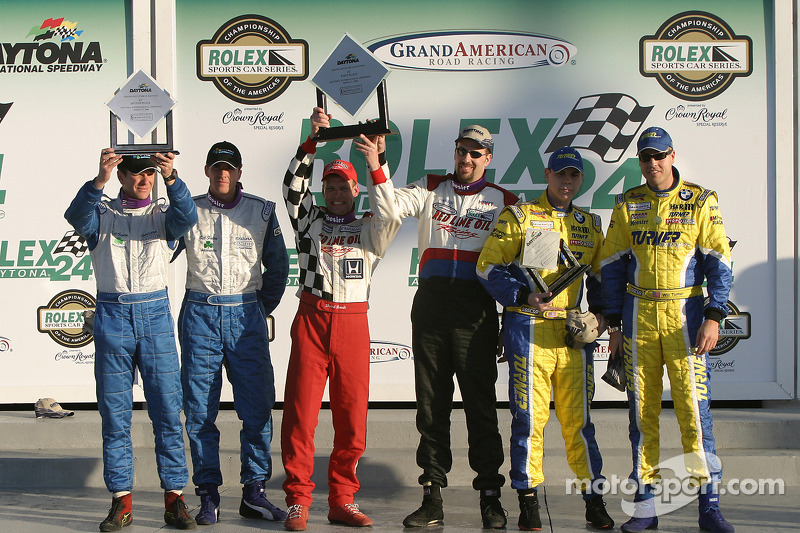 ST podium: class winners John Schmitt and Dave Roush, with second place Hugh Plumb and Matt Plumb, and third place Will Turner and Don Salama
