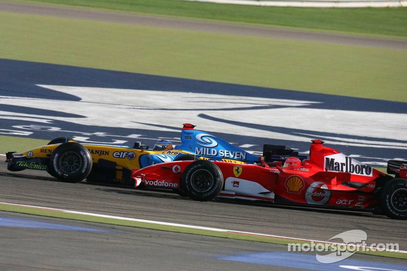 Fernando Alonso passes Michael Schumacher