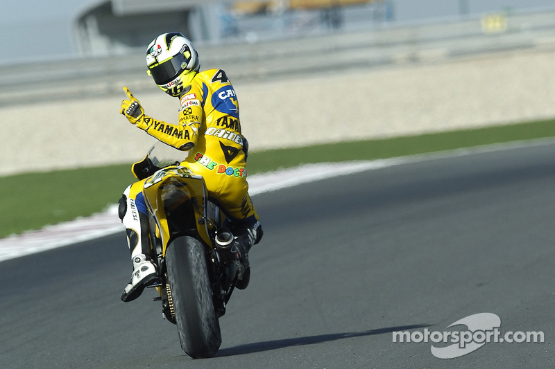 Race winner Valentino Rossi celebrates