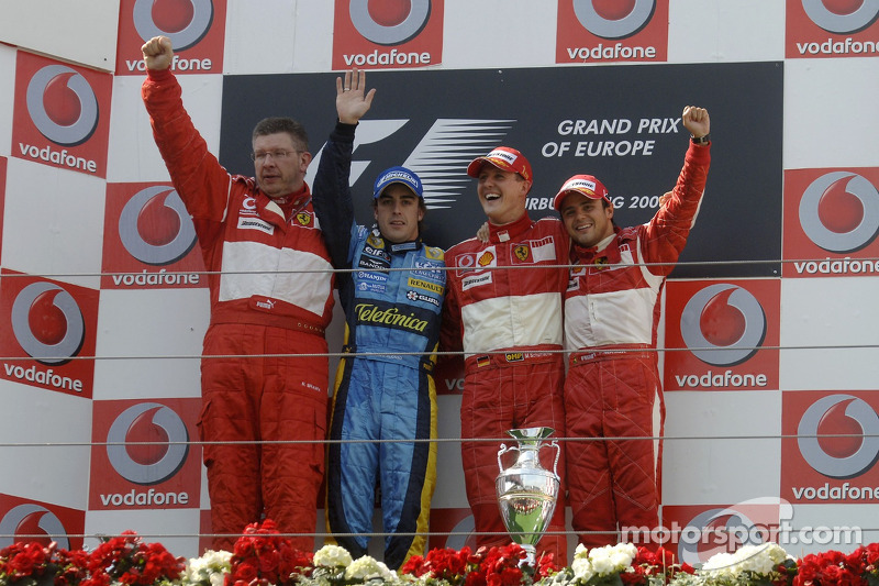 Podium: race winner Michael Schumacher with Fernando Alonso, Felipe Massa and Ross Brawn