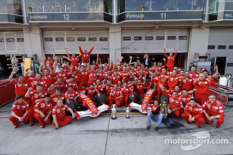 Race winner Michael Schumacher celebrates with his team