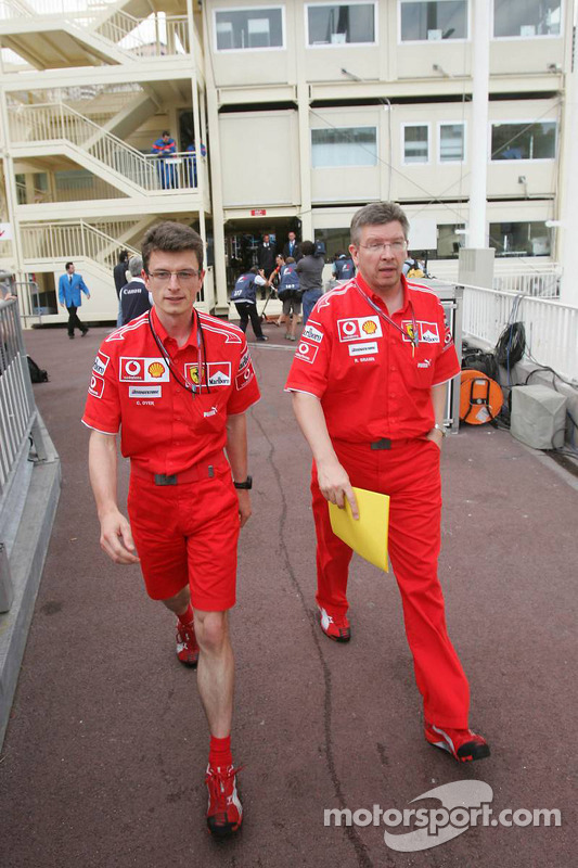 Chris Dyer and Ross Brawn leave the stewards building after a meeting regarding Michael Schumacher's pole position